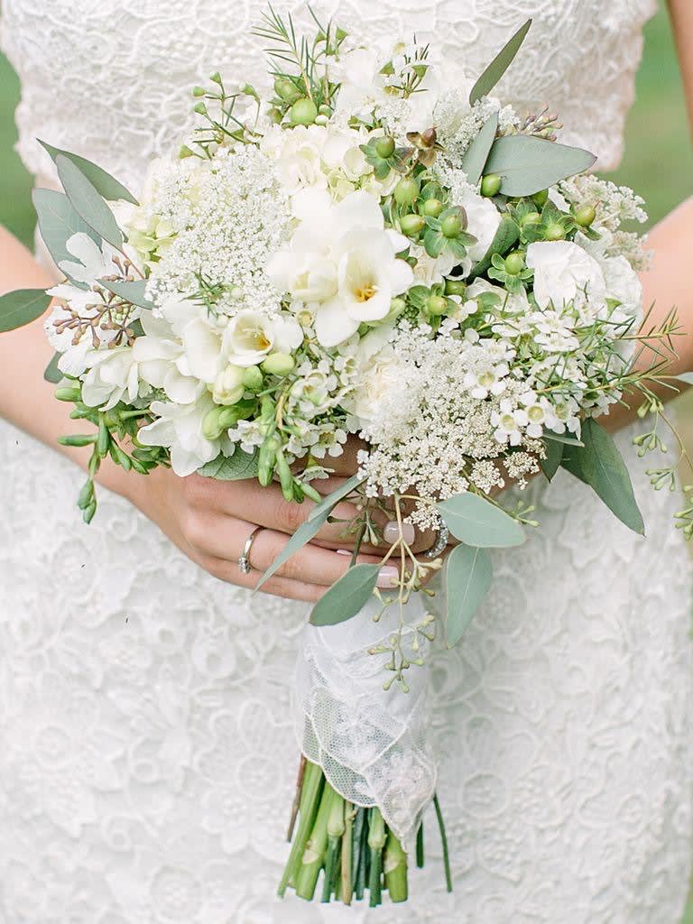 White bridal bouquet with eucalyptus and small white blooms
