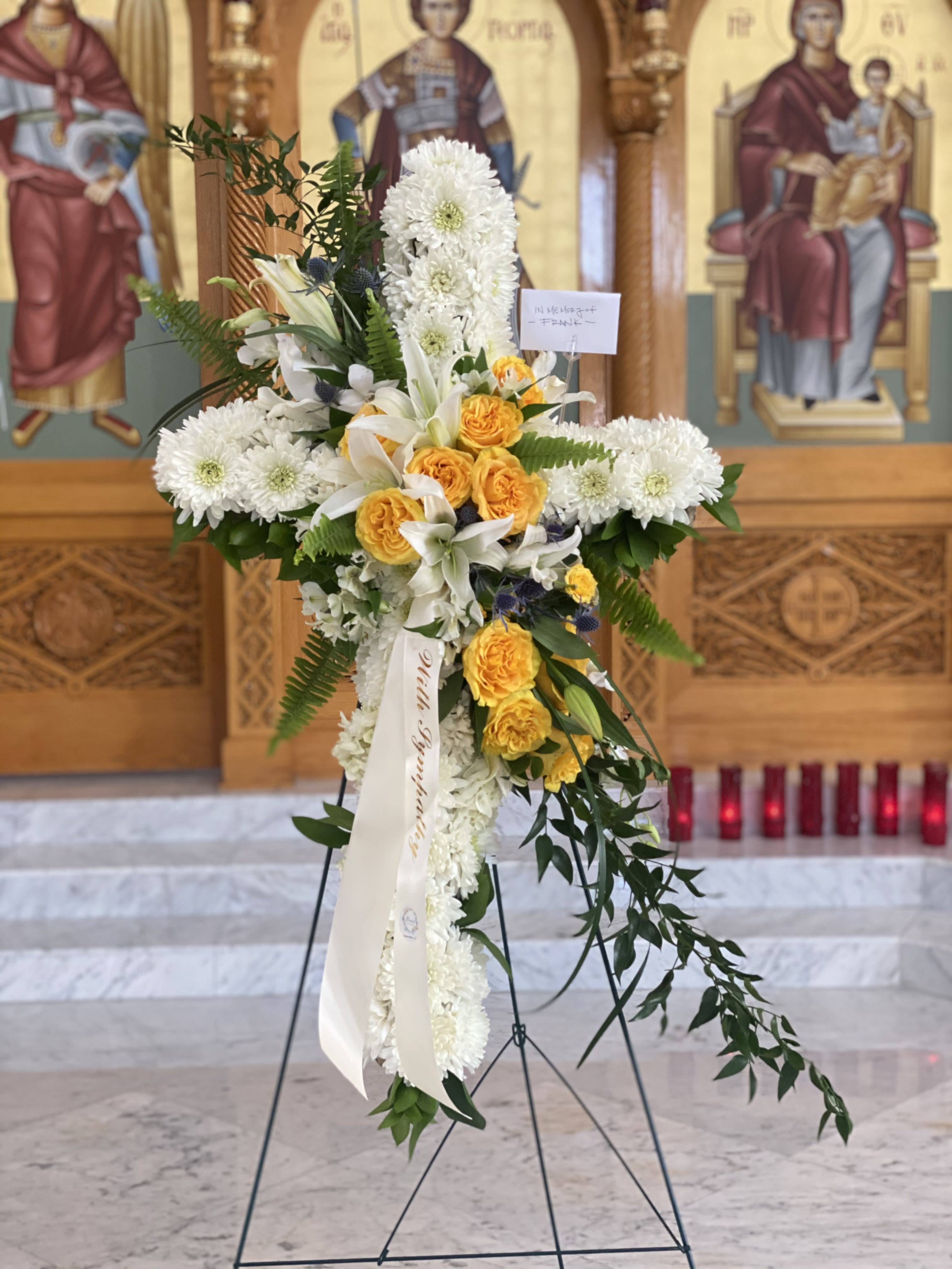 Standing floral cross with white chrysanthemums and yellow roses
