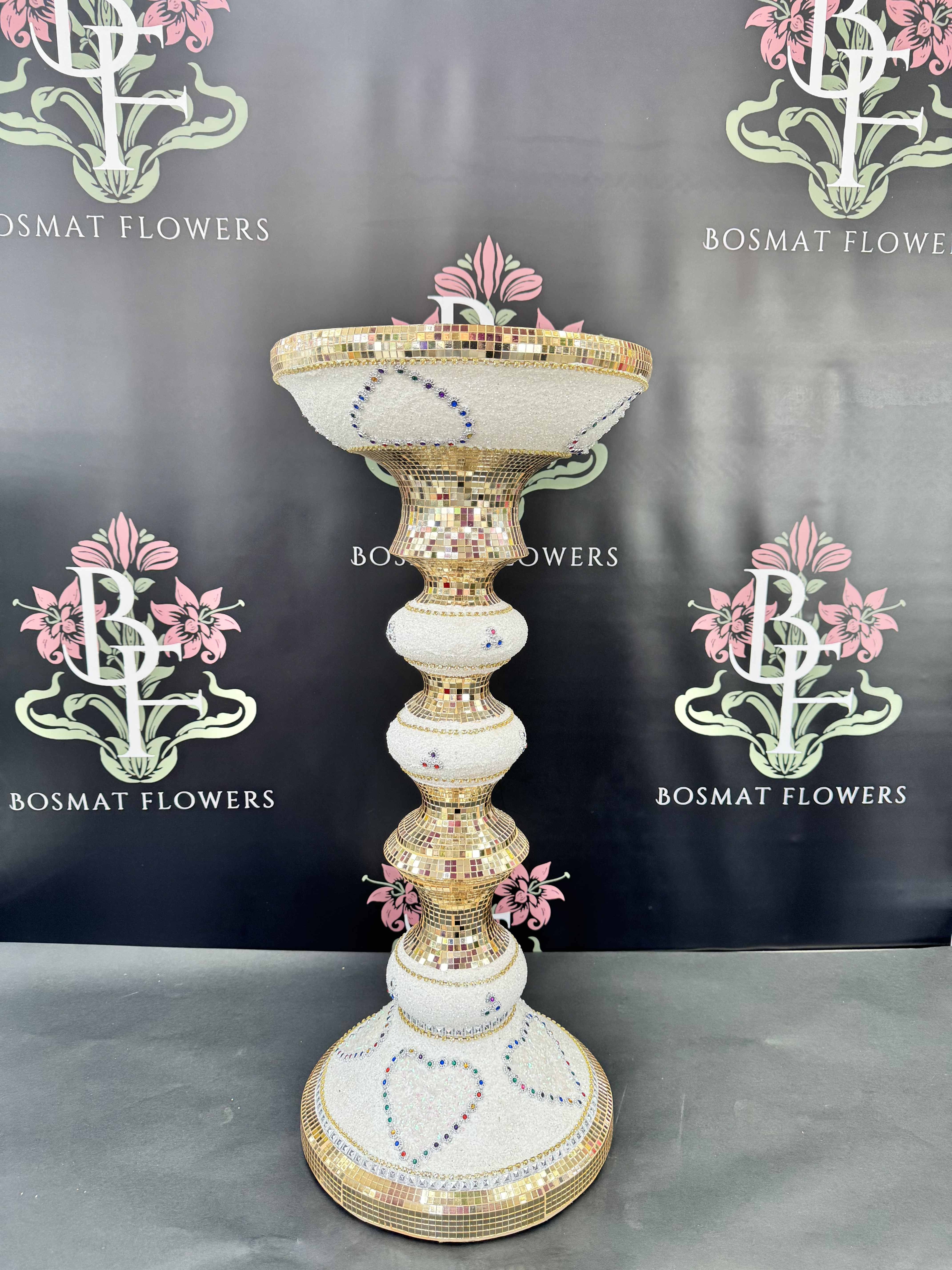 Tall gold-and-white mosaic pedestal vase with jeweled heart accents
