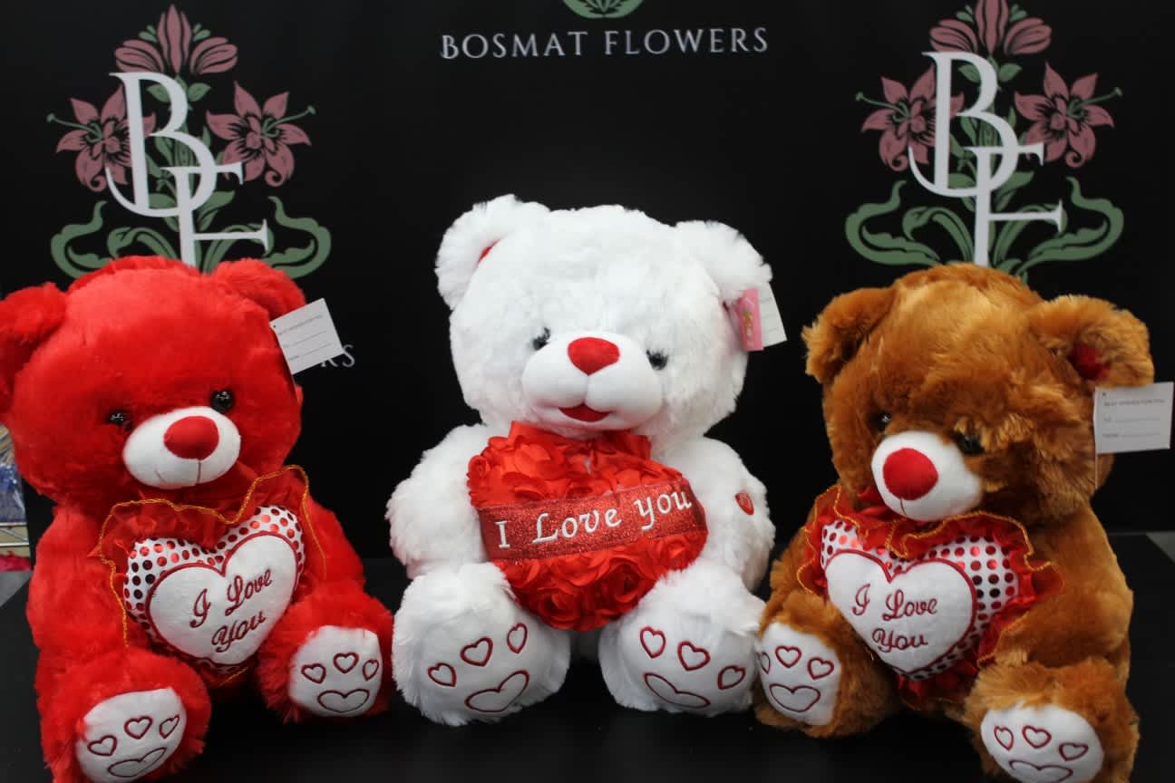 Three plush teddy bears with "I Love You" hearts