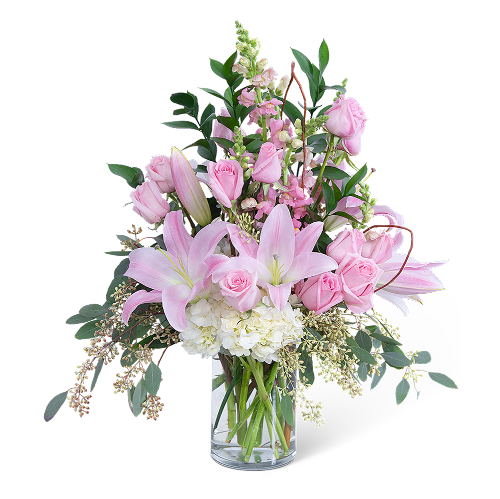 Pink roses and lilies in a clear glass vase