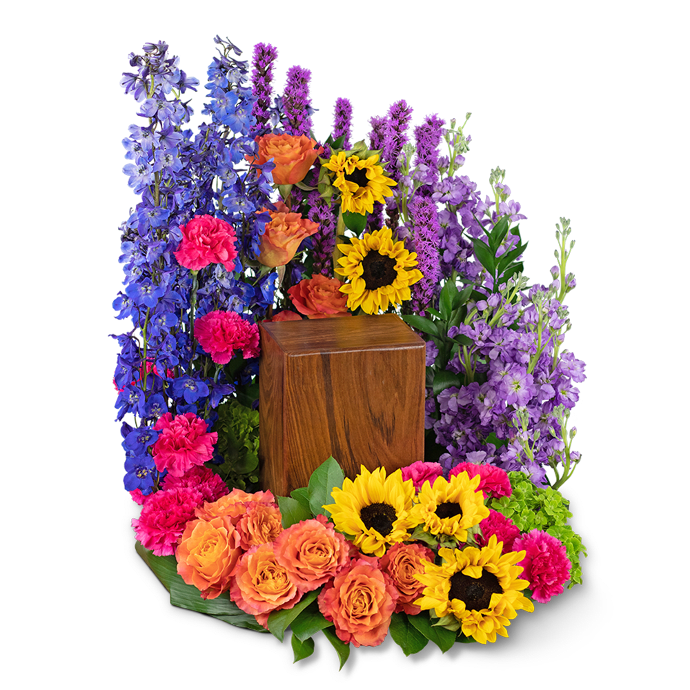 Colorful floral wreath with sunflowers, roses, and purple blooms around a wooden urn