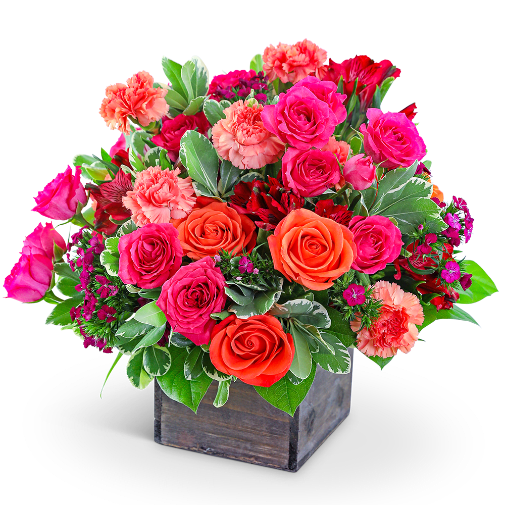 Mixed bouquet of pink and orange roses with carnations in a wooden box