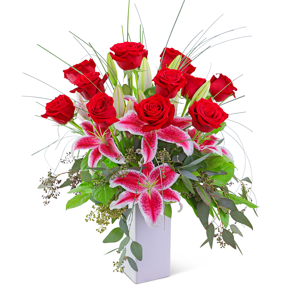 Red roses and pink lilies in a white vase