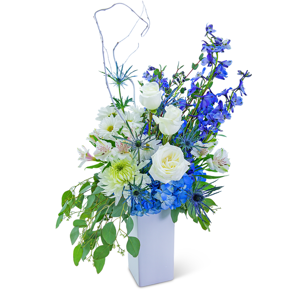 Blue and white floral arrangement in a white vase