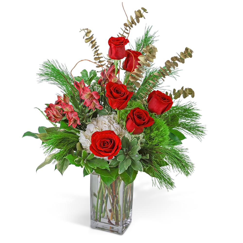 Red roses and white blooms in a clear glass vase with greenery