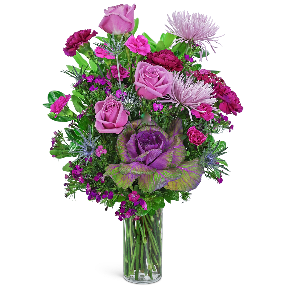Pink and purple mixed bouquet in a clear glass vase