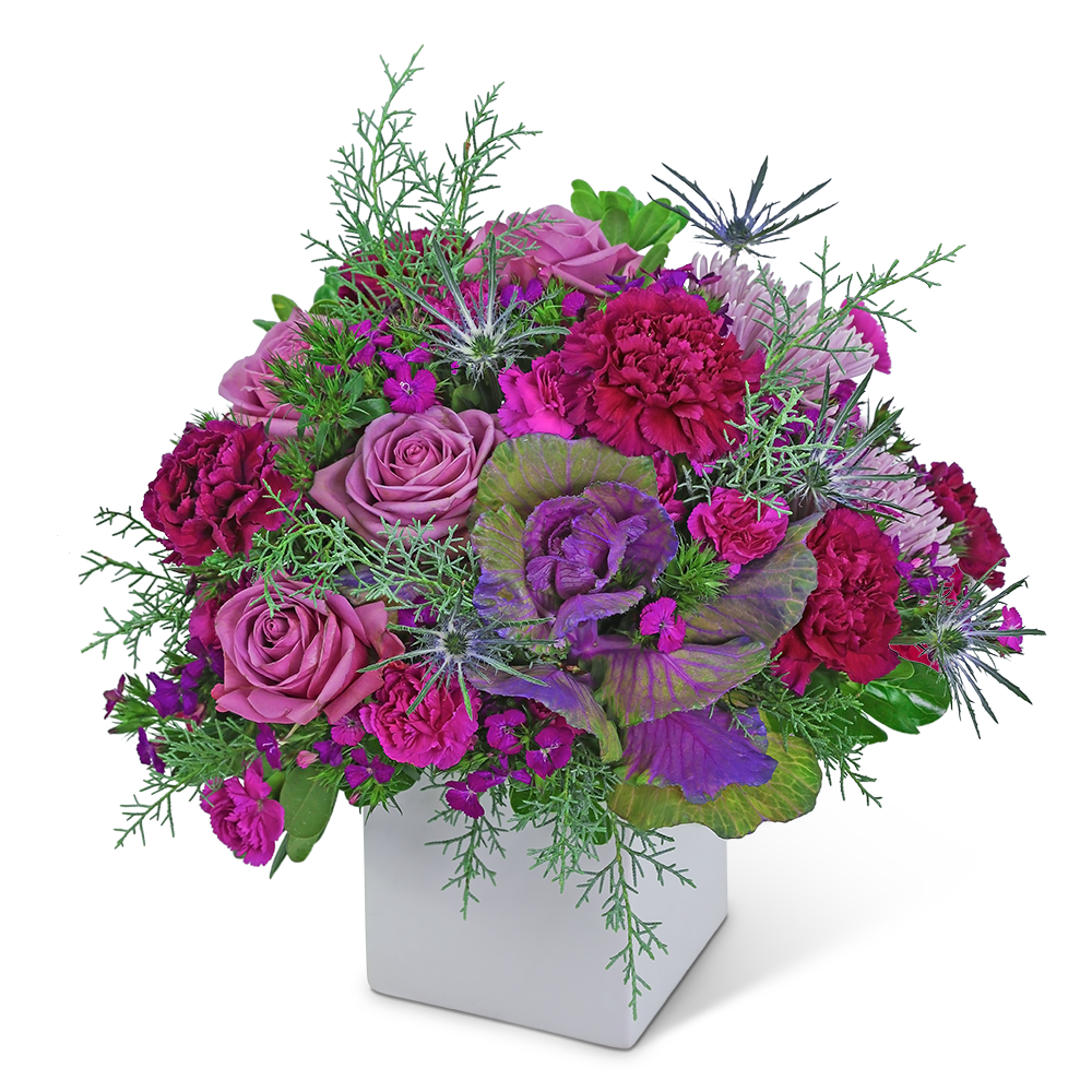 Mulberry Luxe - This artistic flower design will brighten anyone’s day! Mulberry Luxe contains roses, spider mums, carnations, and dianthus accented with a variety of winter foliage. This unique flower arrangement is truly fresh and fabulous and will add a purple pop of color to anyone's home or office. Send these beautiful flowers to celebrate a birthday, anniversary, or any occasion. We offer same-day flower delivery in most cases.