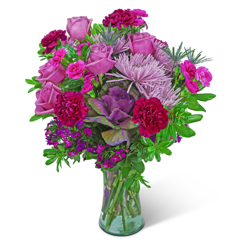 Pink roses and magenta carnations in a clear glass vase