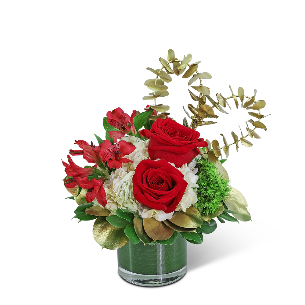 Red roses and white hydrangeas in a glass vase with gold foliage accents