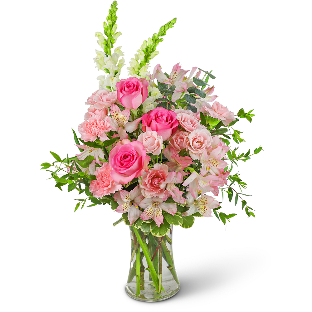 Pink roses and carnations in a clear glass vase