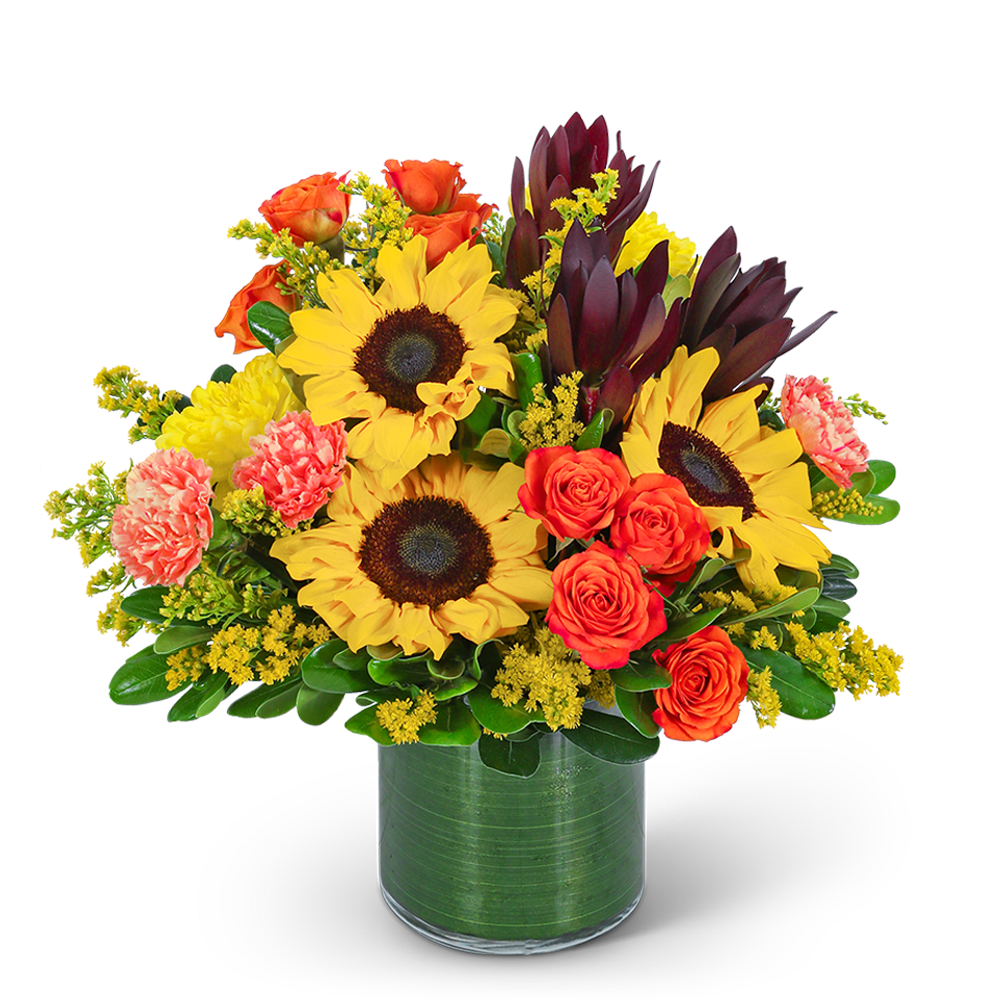 Bouquet of sunflowers, orange roses, and carnations in a green vase