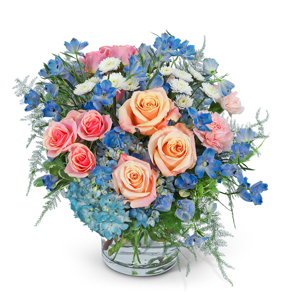 Pink and peach roses with blue and white flowers in a glass vase