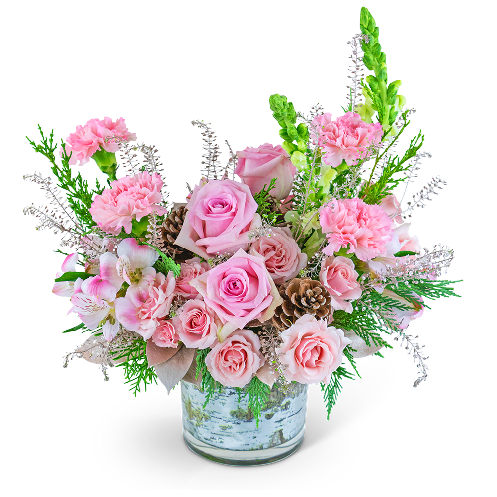 Pink roses and carnations in a glass vase with pinecones