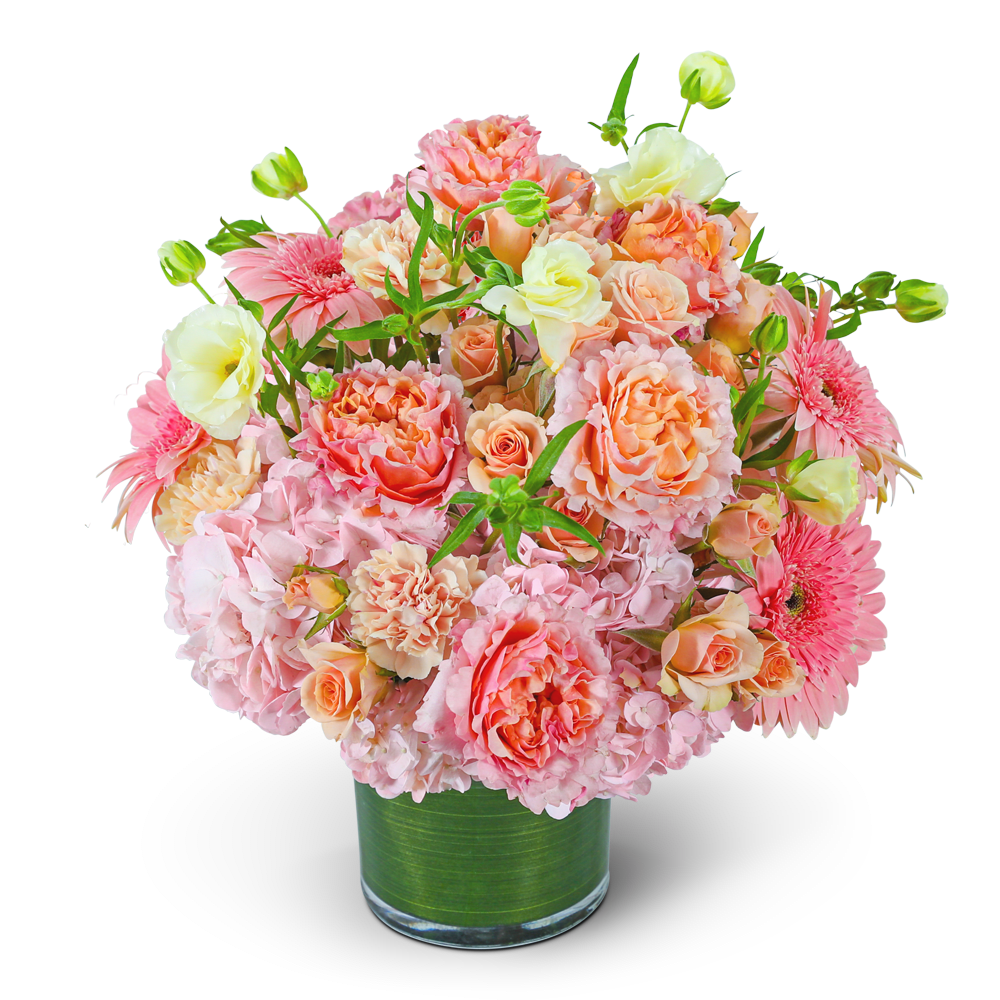 Pink and peach bouquet in a clear glass vase