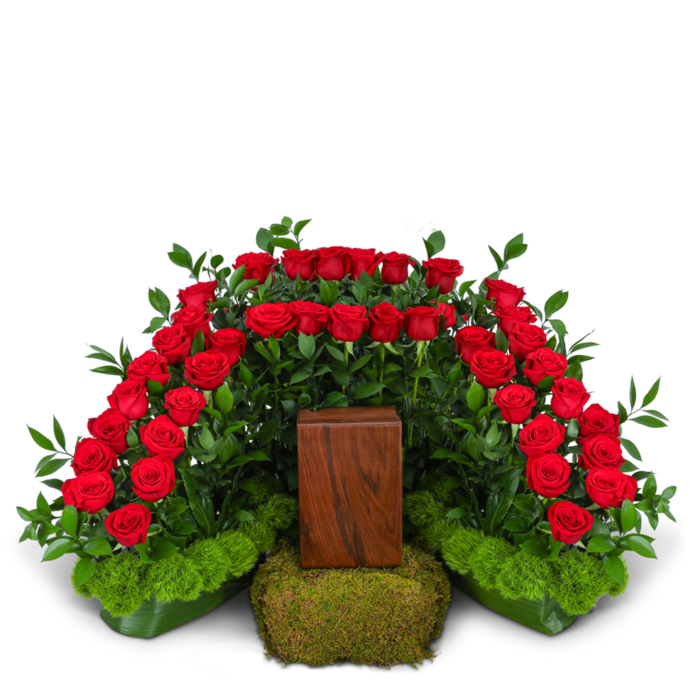 Red roses arranged in a symmetrical display with a wooden pedestal