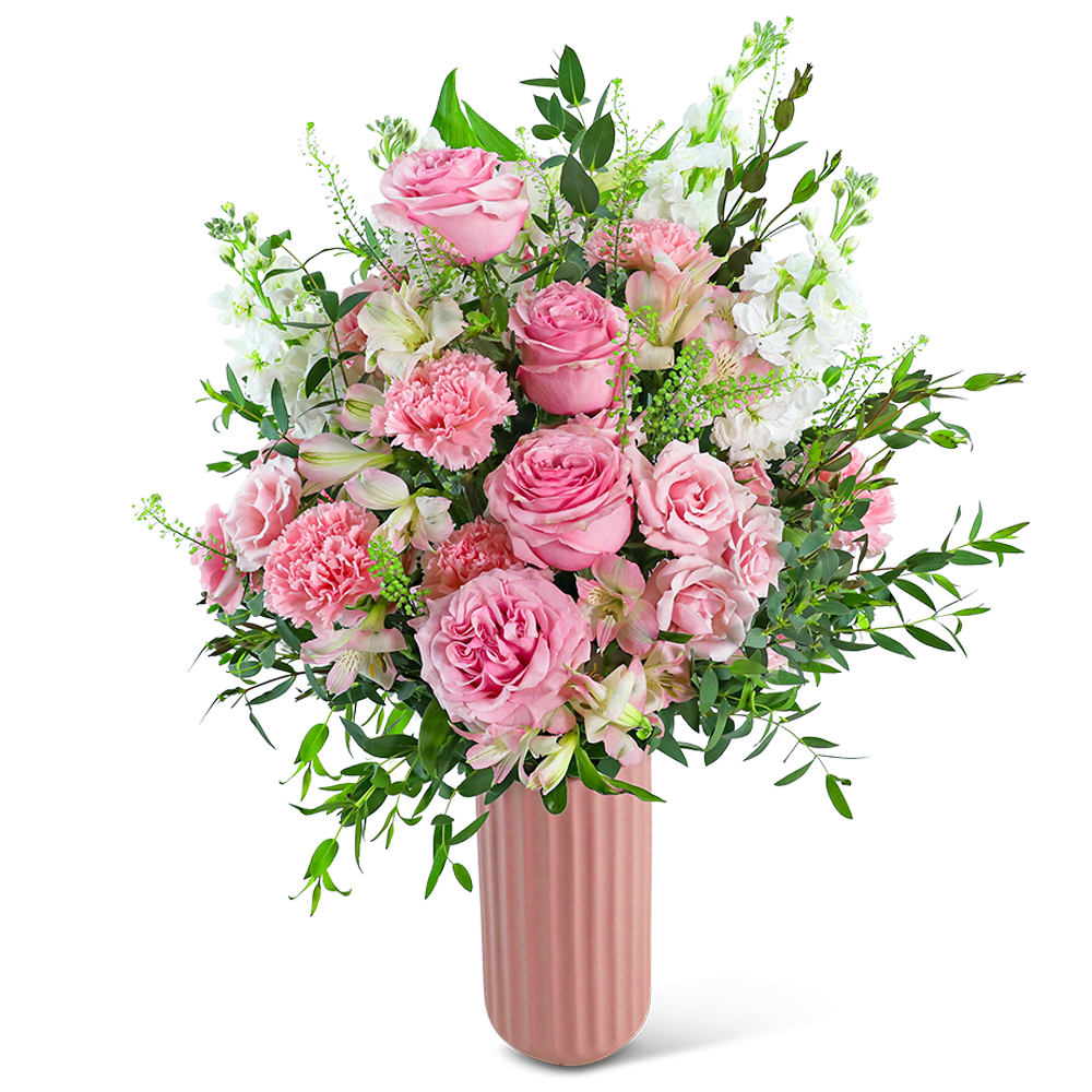 Pink roses and carnations in a tall pink vase
