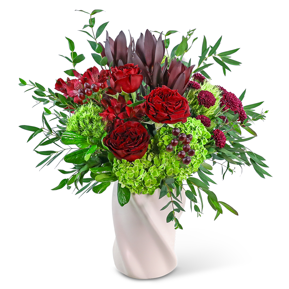 Red roses and green hydrangeas in a white vase