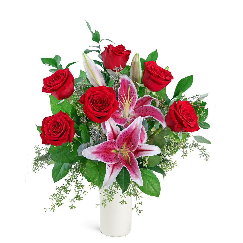 Red roses and pink lilies arranged in a white vase