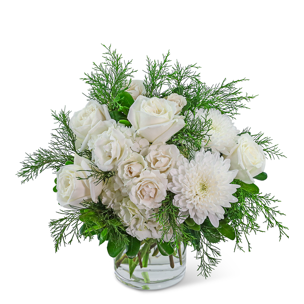 White roses and chrysanthemums in a clear glass vase