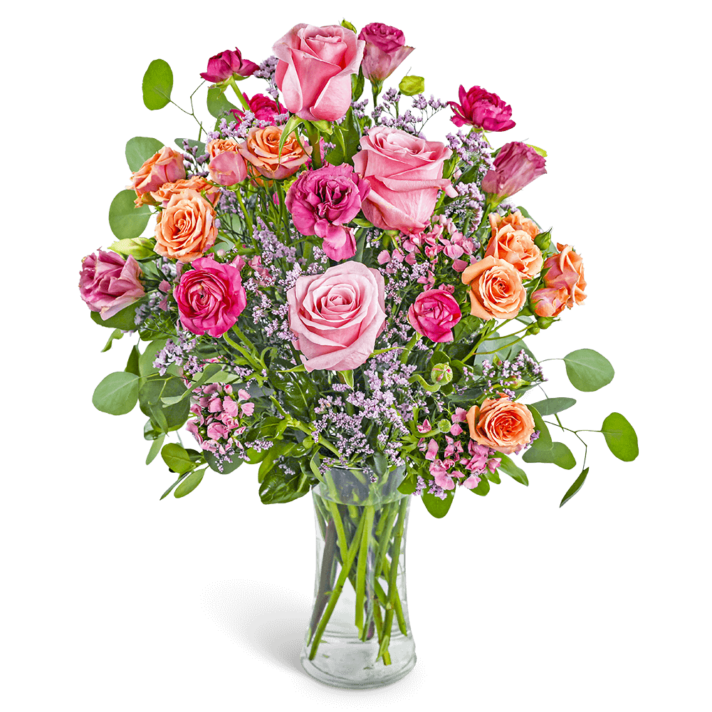 Pink and peach rose bouquet in a clear glass vase