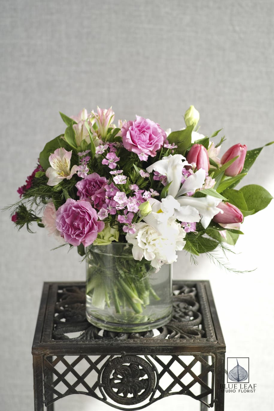 Pink and white mixed bouquet in a clear glass vase