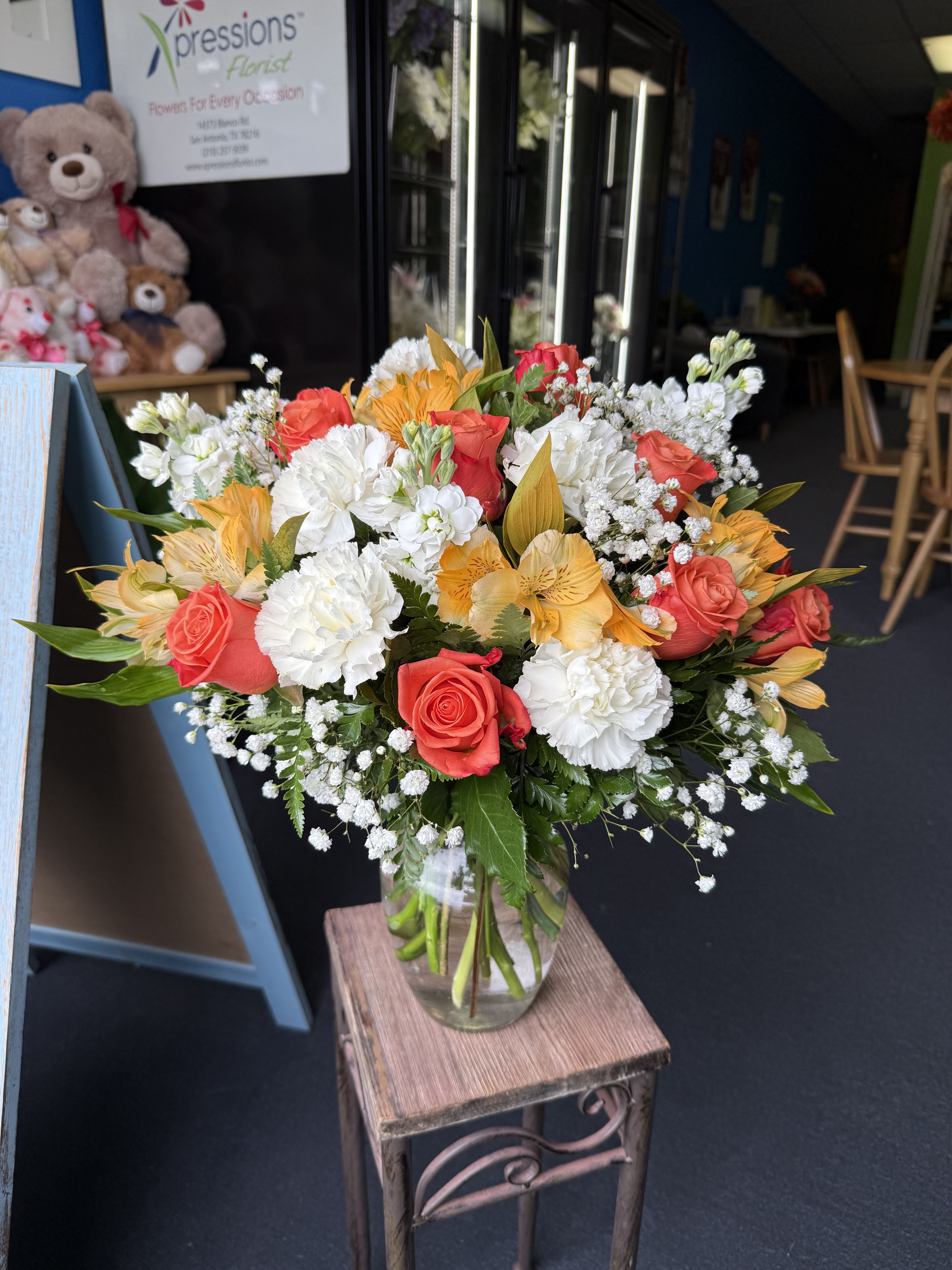 Sweet Citrus Bouquet - (ONE-SIDED) Orange roses accented with delicate white blooms for a bright, cheerful bouquet-warm, uplifting and perfect for celebrations or to brighten someone's day
