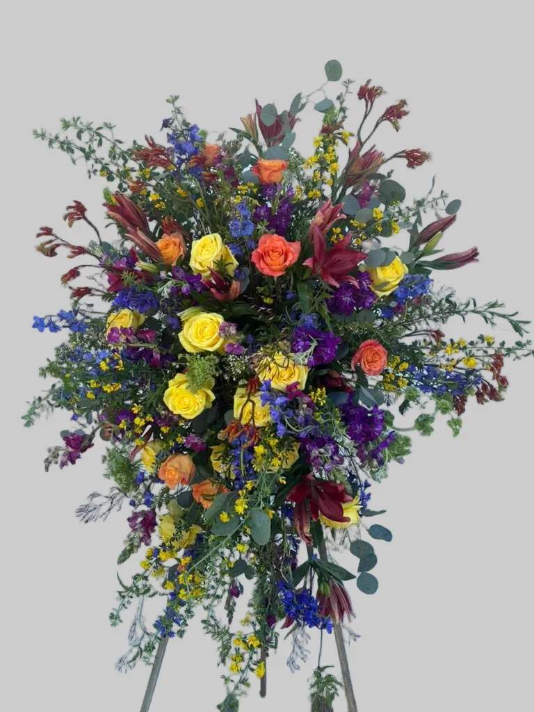 Large standing spray with multicolored roses and lilies
