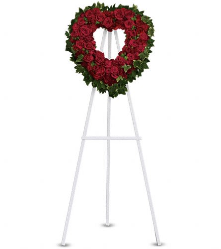 Blessed Heart - T225-2A - A beautiful heart is a wonderful way to share your thoughts of love. Red roses spray roses carnations and miniature carnations are arranged with fern and ivy in the shape of a heart.Approximately 23" W x 24" H Orientation: One-Sided As Shown : T225-2A