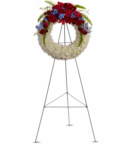 Reflections of Glory Wreath - T241-1A - A stunning display of patriotism strength and sympathy. This red white and blue wreath delivers a lovely message about the dignity of the deceased. A lovely array of flowers such as blue hydrangea red roses and spray roses delicate blue delphinium red gladioli white cushion spray chrysanthemums and more create a circle of serene beauty.Approximately 24 1/2" W x 24 1/2" H Orientation: One-Sided As Shown : T241-1A