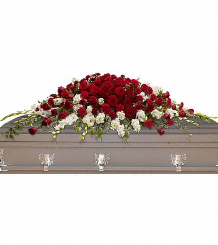 Red and white rose casket spray on a gray casket