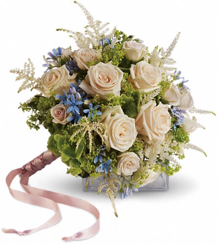 Bouquet of cream roses with blue accents and a pink ribbon handle