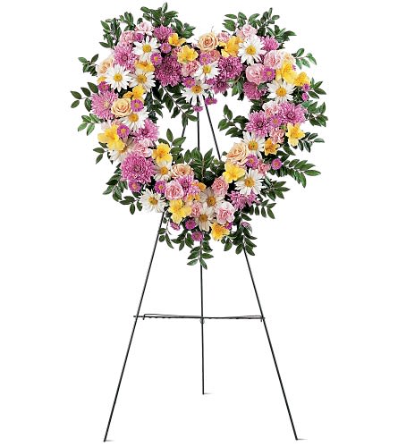 Heart-shaped floral wreath on a standing easel