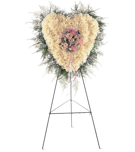 Heavenly Heart - TF220-3 - This lovely heart shows friends and loved ones just how great your love will always be. One solid-flower heart arrives on an easel decorated with nosegay of pink white and blue flowers mounted in the center.Approximately 14" W x 18" H Orientation: One-Sided As Shown : TF220-3