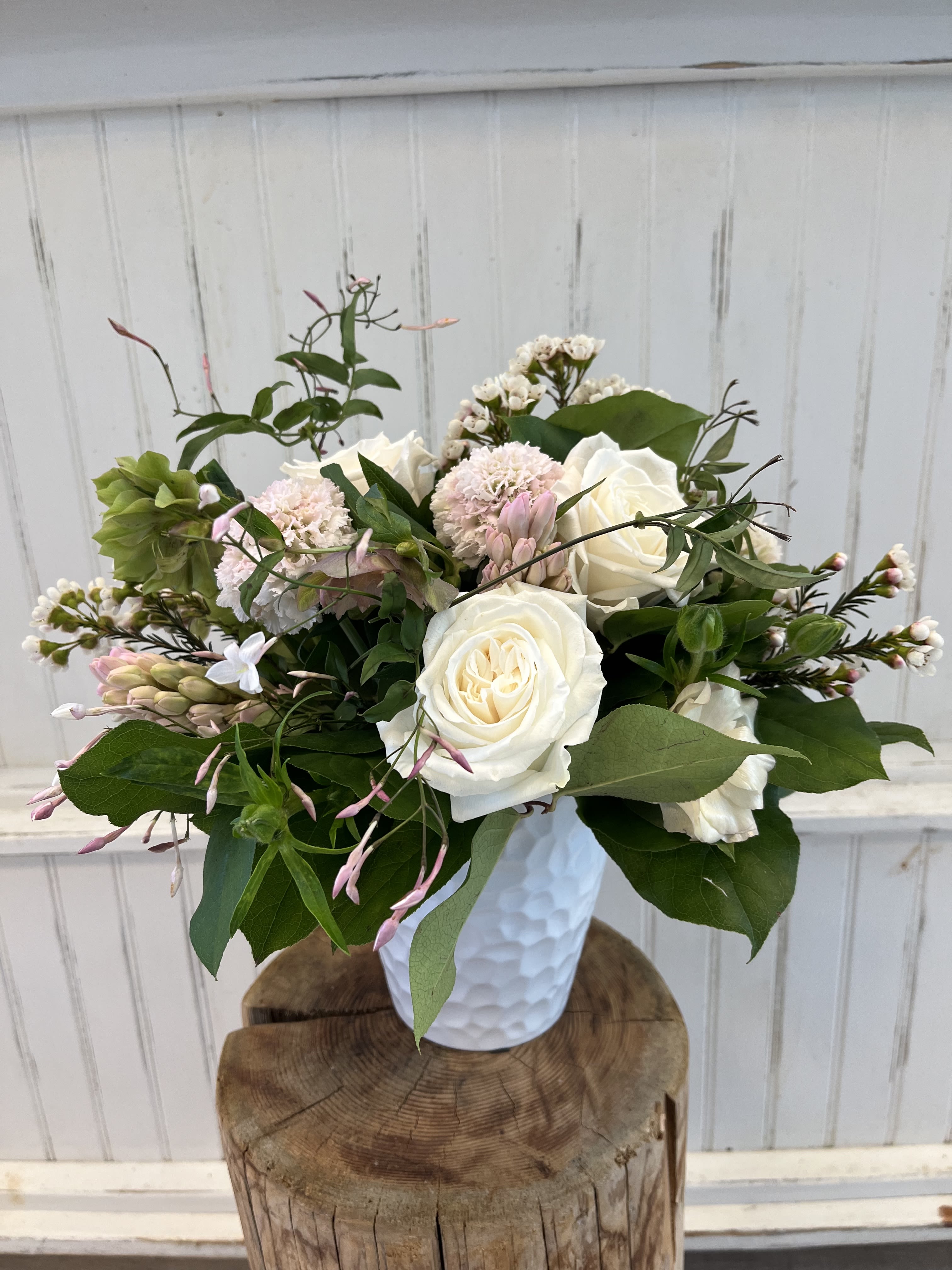 Shades of Pale - Roses, hyacinth, scabiosa, waxflower in a white vase