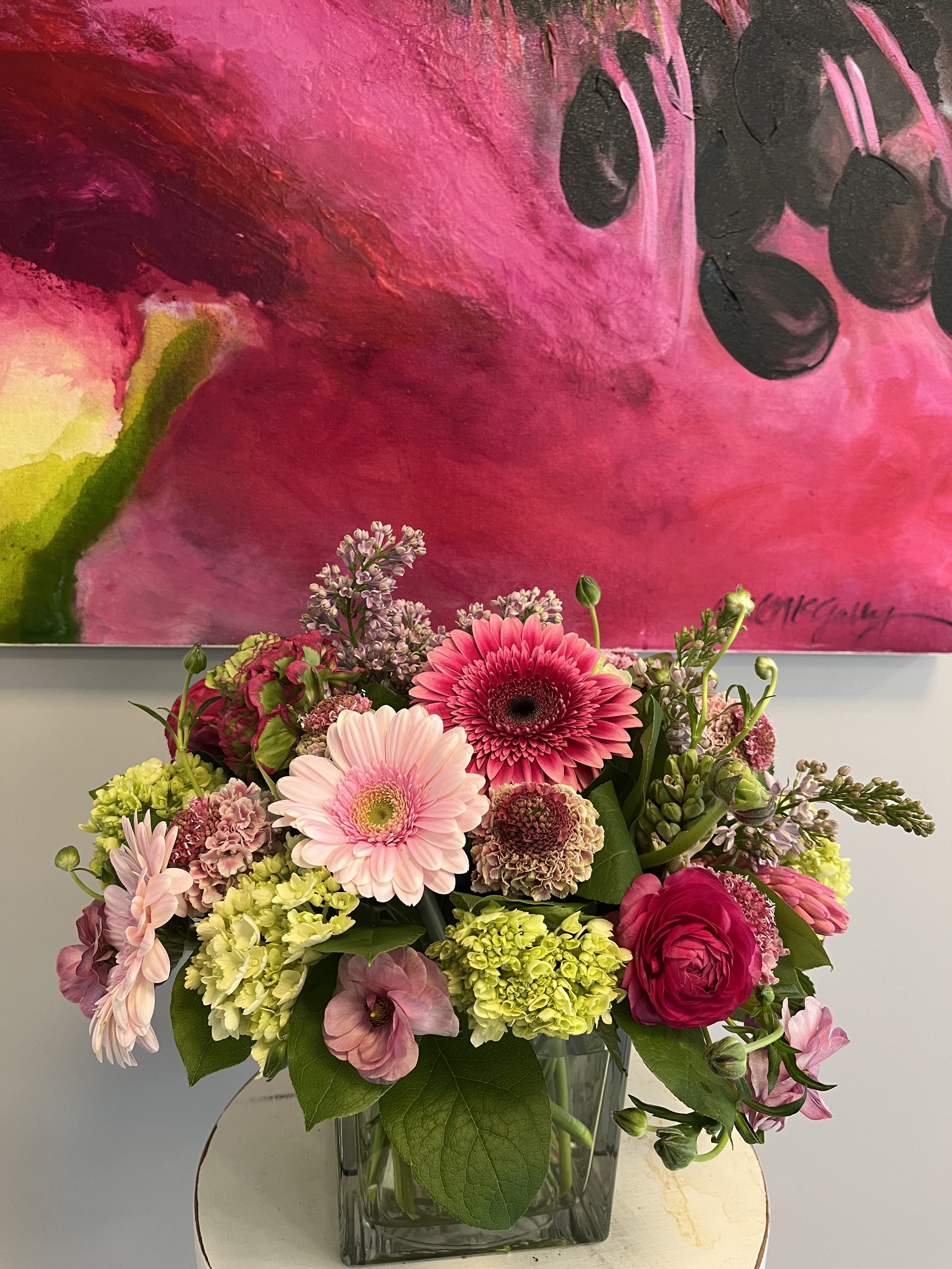 Serendipity - Gerbera Daisies,  anemone, hydrangeas, scabiosa, ranunculus, in a clear vase