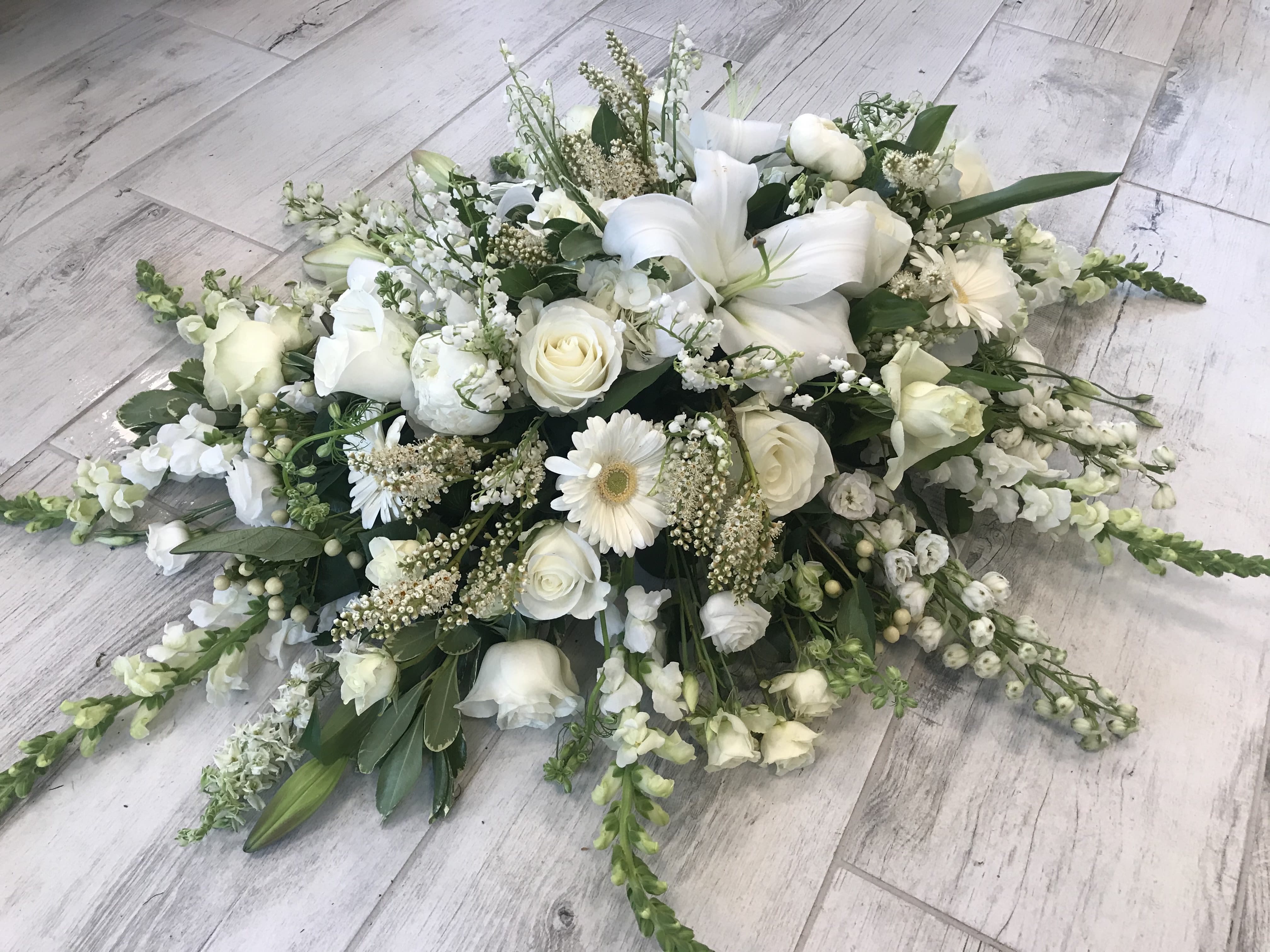 Bereavement Spray - All white flowers for a standing spray, Premium pricing may be a casket spray or large standing spray on easel.