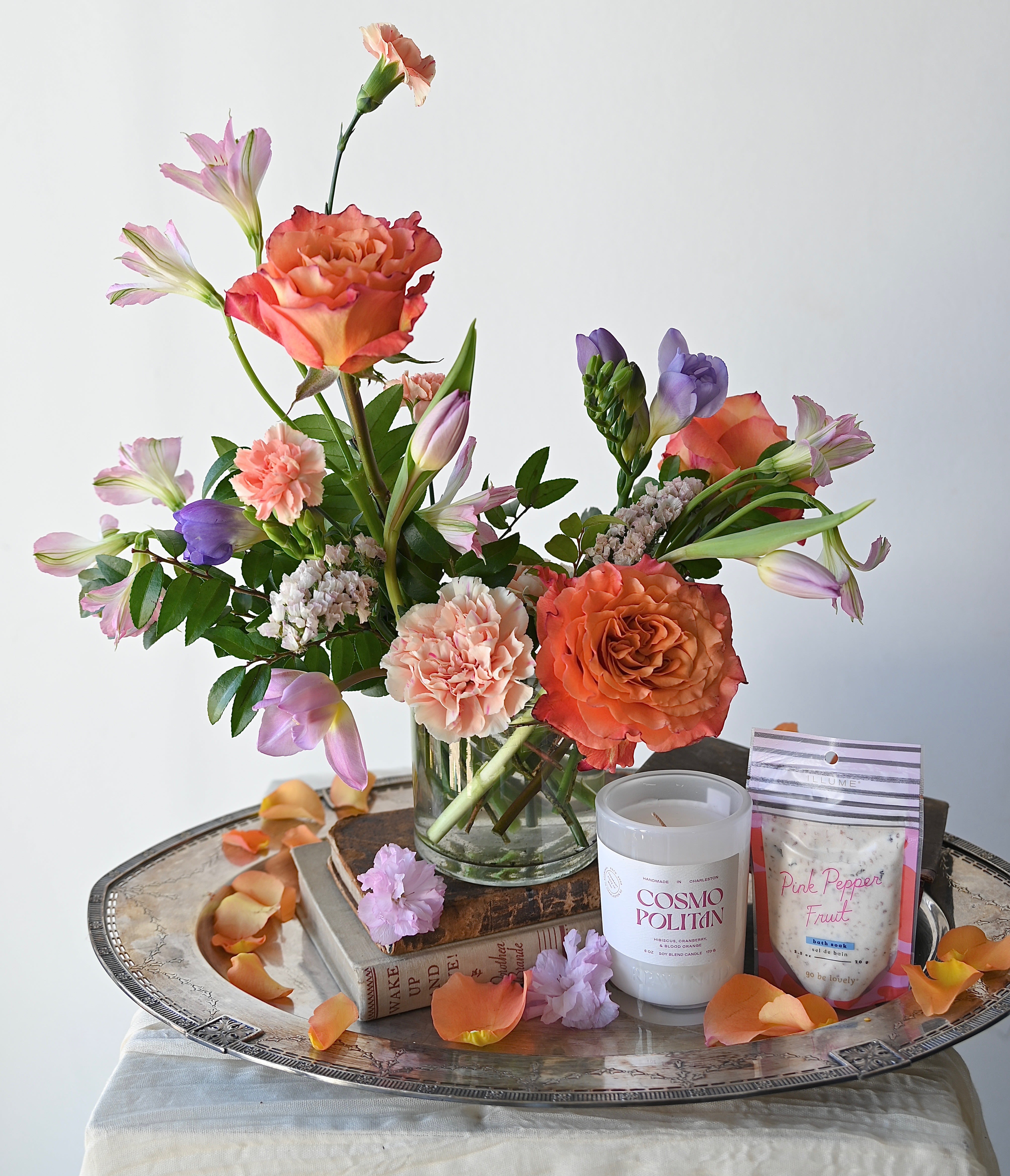 BLOOM &amp; UNWIND - This bundle pairs a small arrangement with a hand-selected Rewined candle and a Pink Pepper Fruit bath soak.  A perfectly balanced gift of beauty and relaxation.