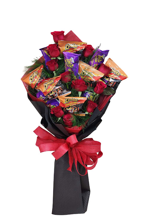 Fiery Love - Fiery Love – A bold and unforgettable statement of passion and spice! This striking lay-down bouquet features a dozen rich long stem red roses, accented with delicate greens for a fresh touch. Scattered throughout, multiple bags of Hot Cheetos and Takis add a playful and fiery twist, making this arrangement perfect for those who love a little heat with their romance. Finished with bold black embossed wrapping, "Fiery Love" is the ultimate blend of elegance, excitement, and modern flair.
