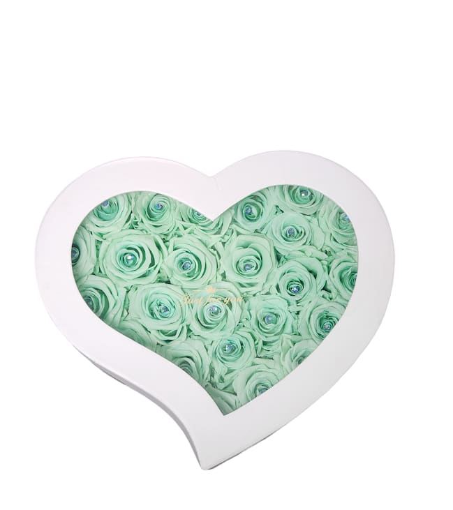 Heart-shaped box filled with mint green roses