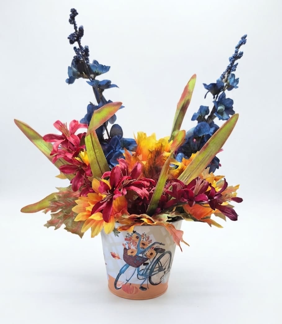 Colorful floral arrangement in a decorated ceramic pot