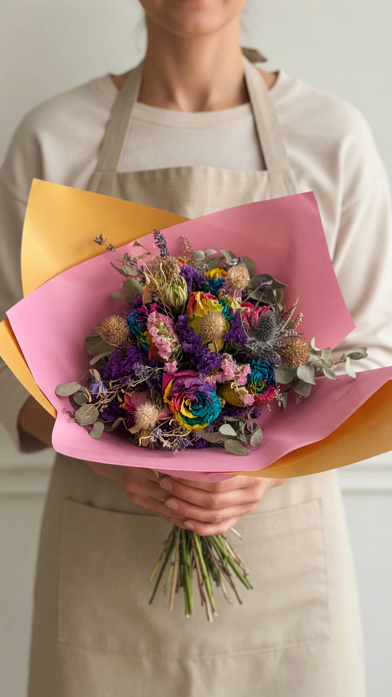 Rainbow Sprinkles Dried Bouquet  - A playful explosion of color, this Rainbow Sprinkles dried bouquet is a cheerful birthday and just-because flower bouquet that instantly lifts a room. The mixed-color, pink, purple, yellow and blue palette - centered on rose-like blooms and bright dried textures - reads joyful and celebratory, making it ideal for birthdays, congratulations, or to say thank you. It also works beautifully for anniversaries, housewarmings, new baby celebrations, and to brighten a get-well moment.