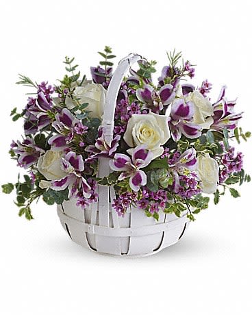 White basket of purple orchids and white roses