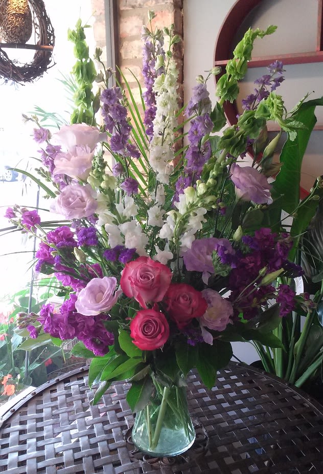 Joyful Memory - Lavender and white sympathy flowers make a grand statement in this joyful bouquet. Cherish your memories with this lasting remembrance of bells of Ireland, larkspur, lisianthus, snapdragon, stock and roses.