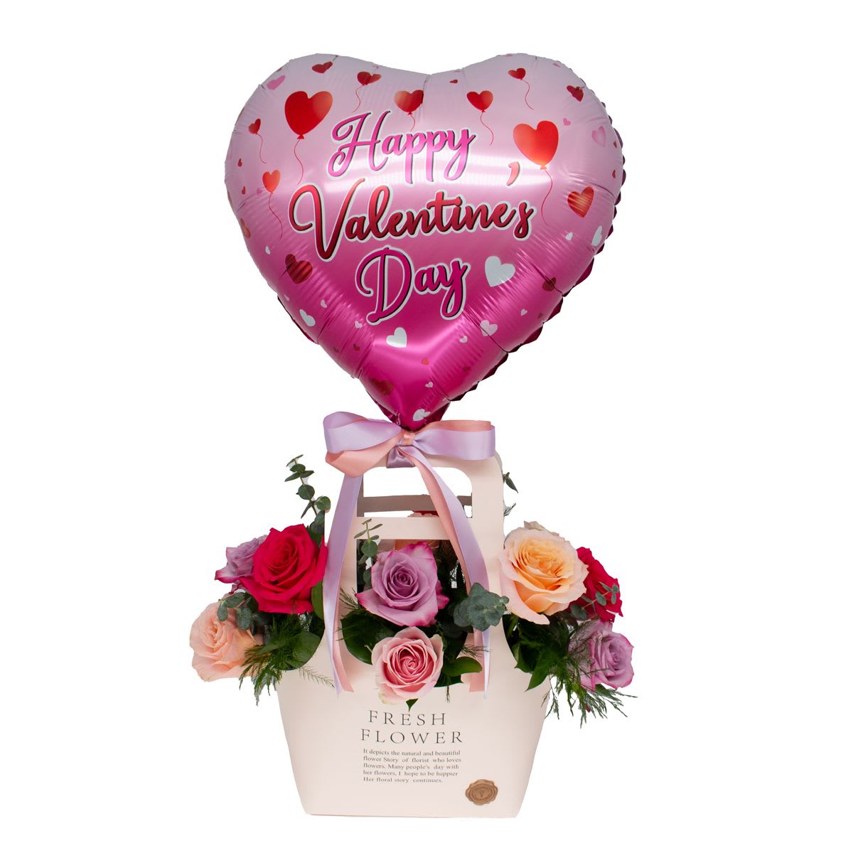 Heart-shaped Valentine balloon above a box of roses with ribbon