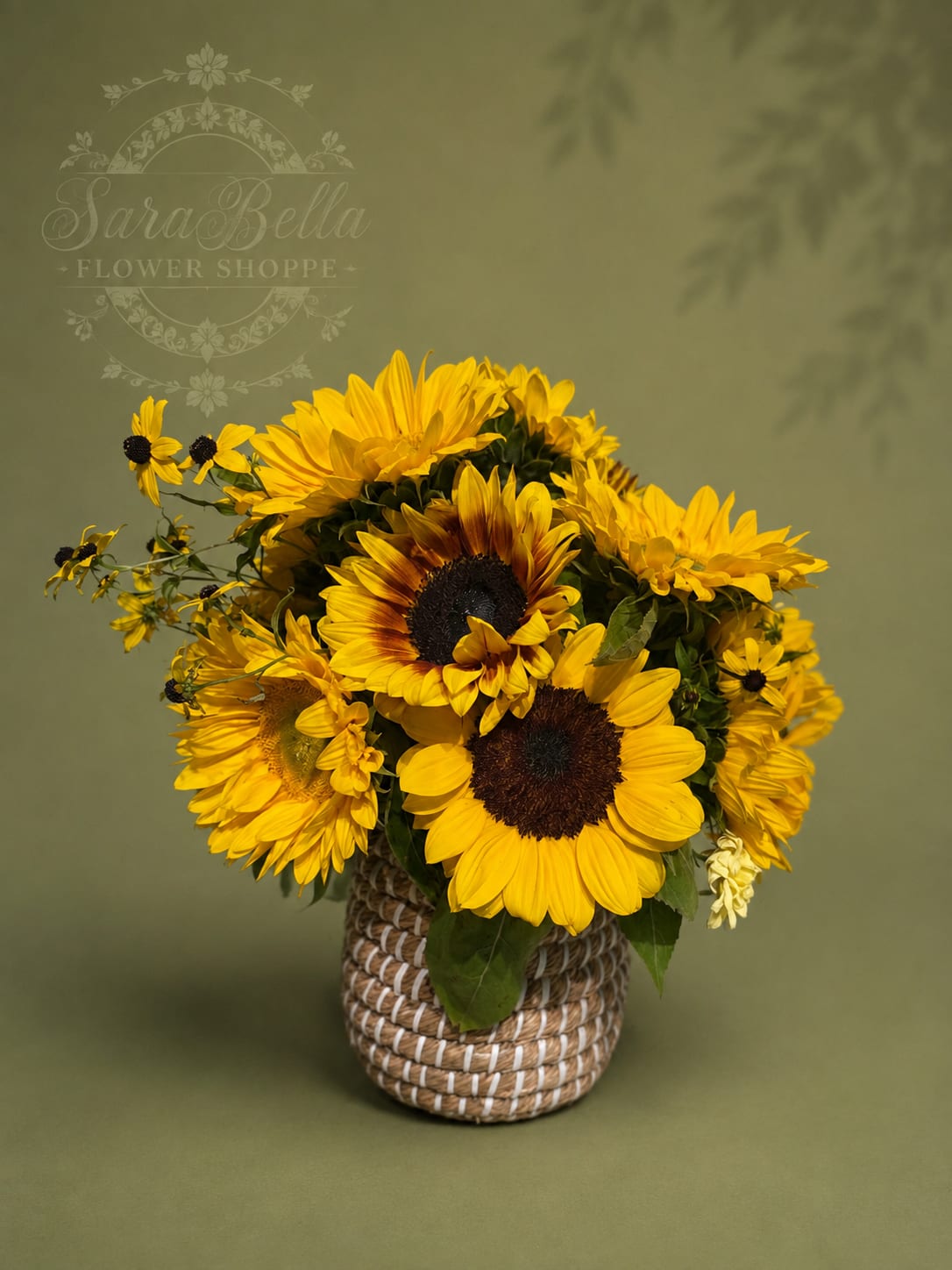 Yellow sunflower bouquet in a woven basket vase