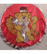 Round red balloon with a teddy bear wearing a hat and tie