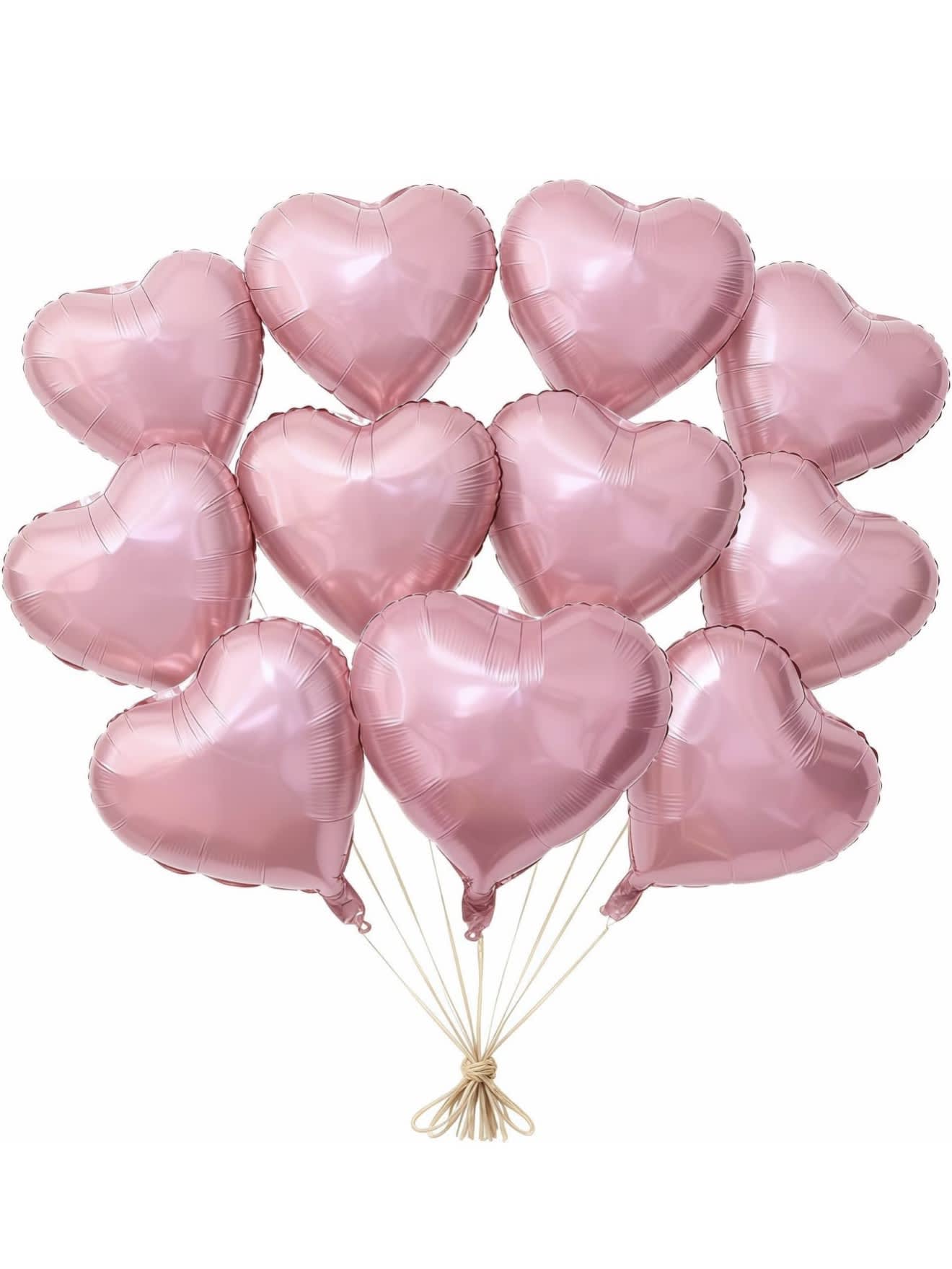 Cluster of pink heart-shaped balloons tied together with string