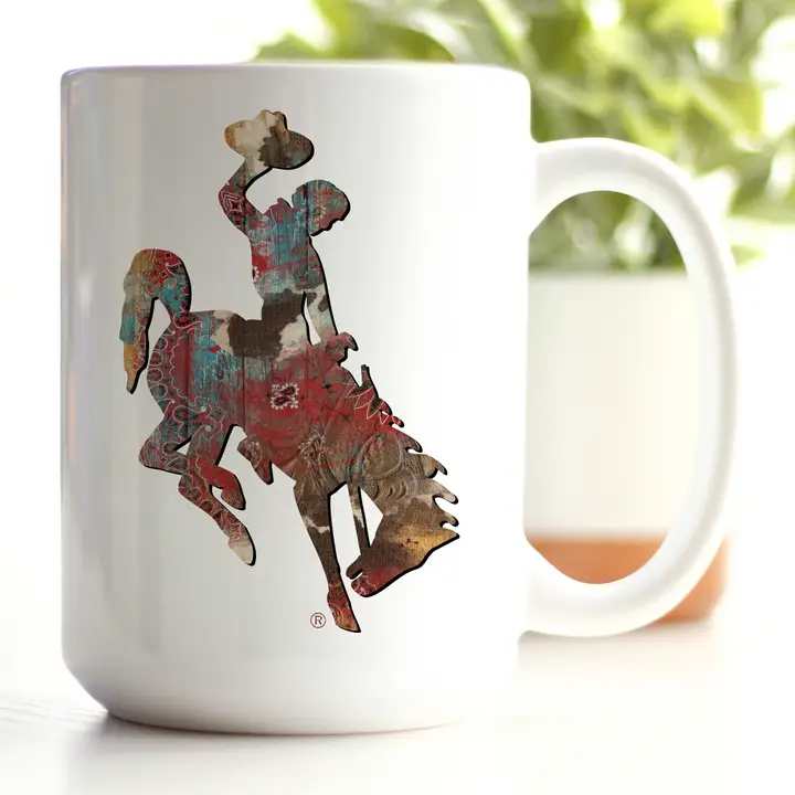 White mug with a colorful cowboy rider silhouette