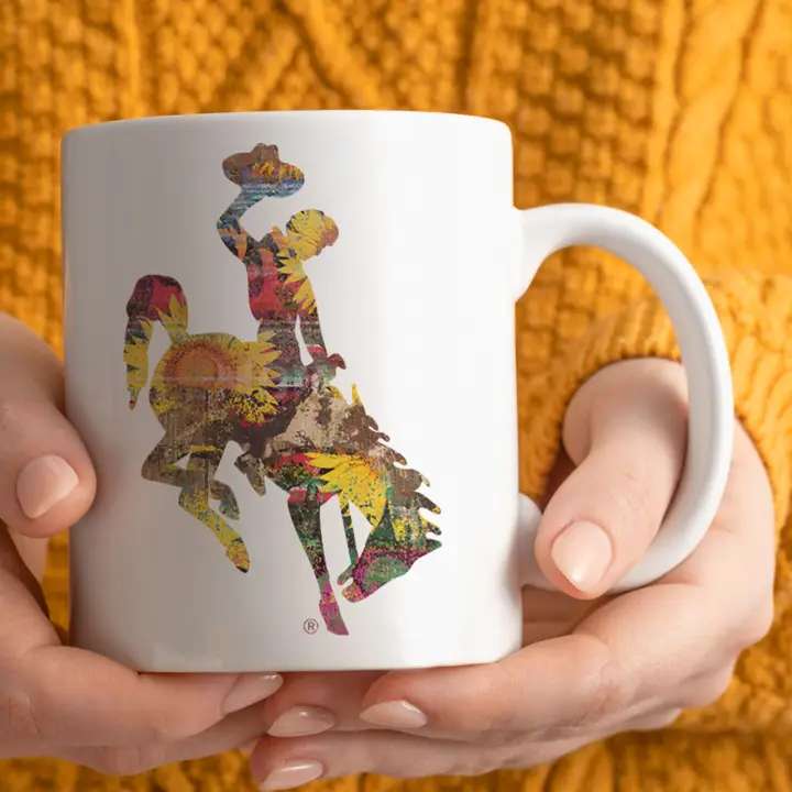 White mug with a colorful floral dancer graphic